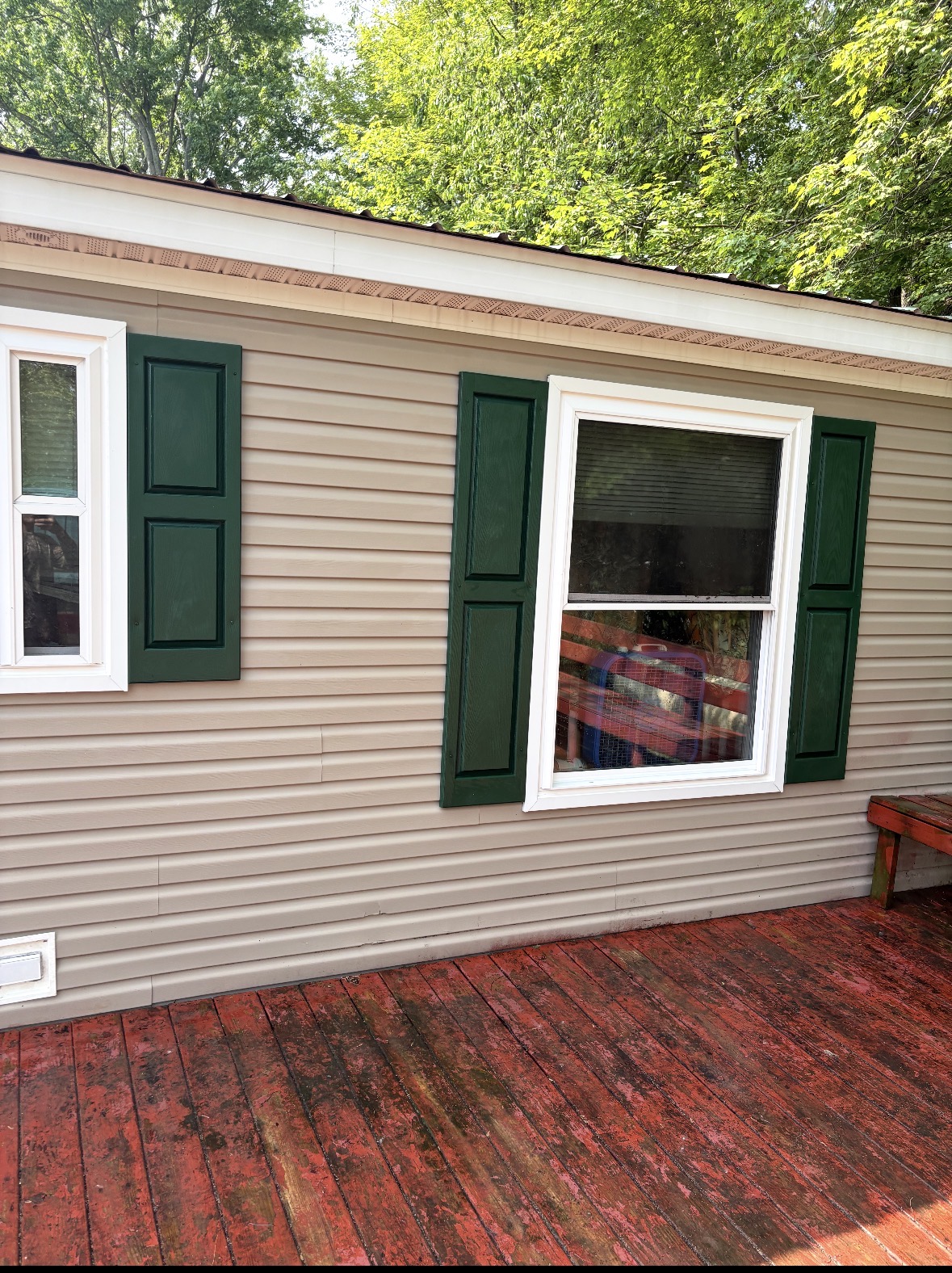 Michigan red deck and window after pressure washing and cleaning