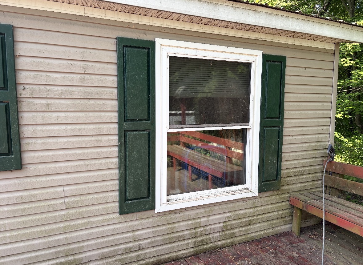 Michigan deck and window before pressure washing and cleaning